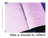 An image of an open book with the text ‘Take a minute to reflect’ underneath